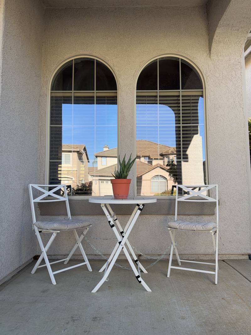 Bistro table and chairs on the covered front porch